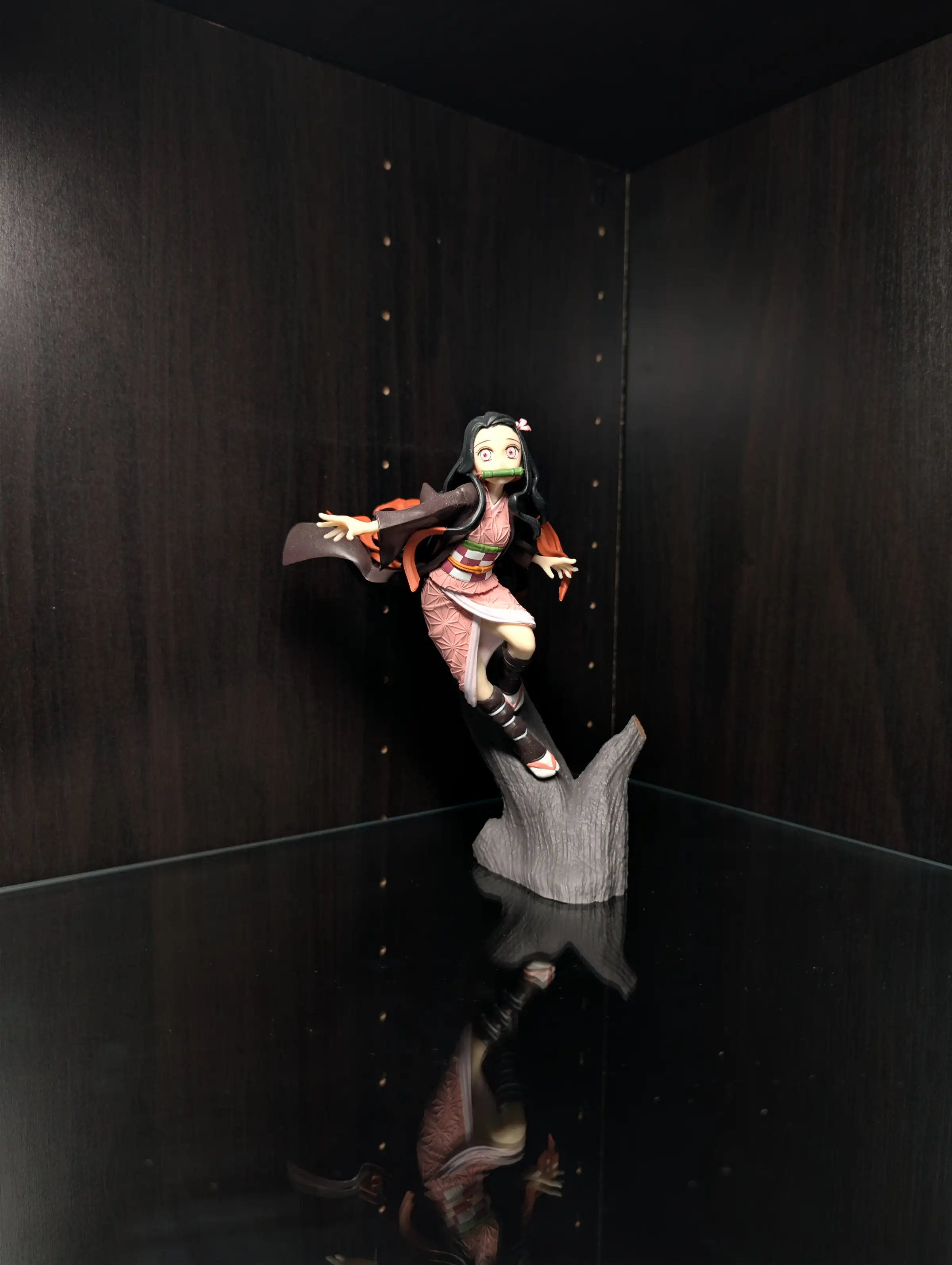 Image of figure Nezuko on a log